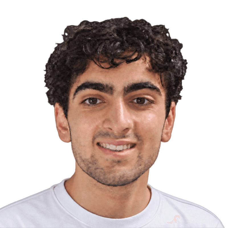 Sepehr smiling in a white t-shirt